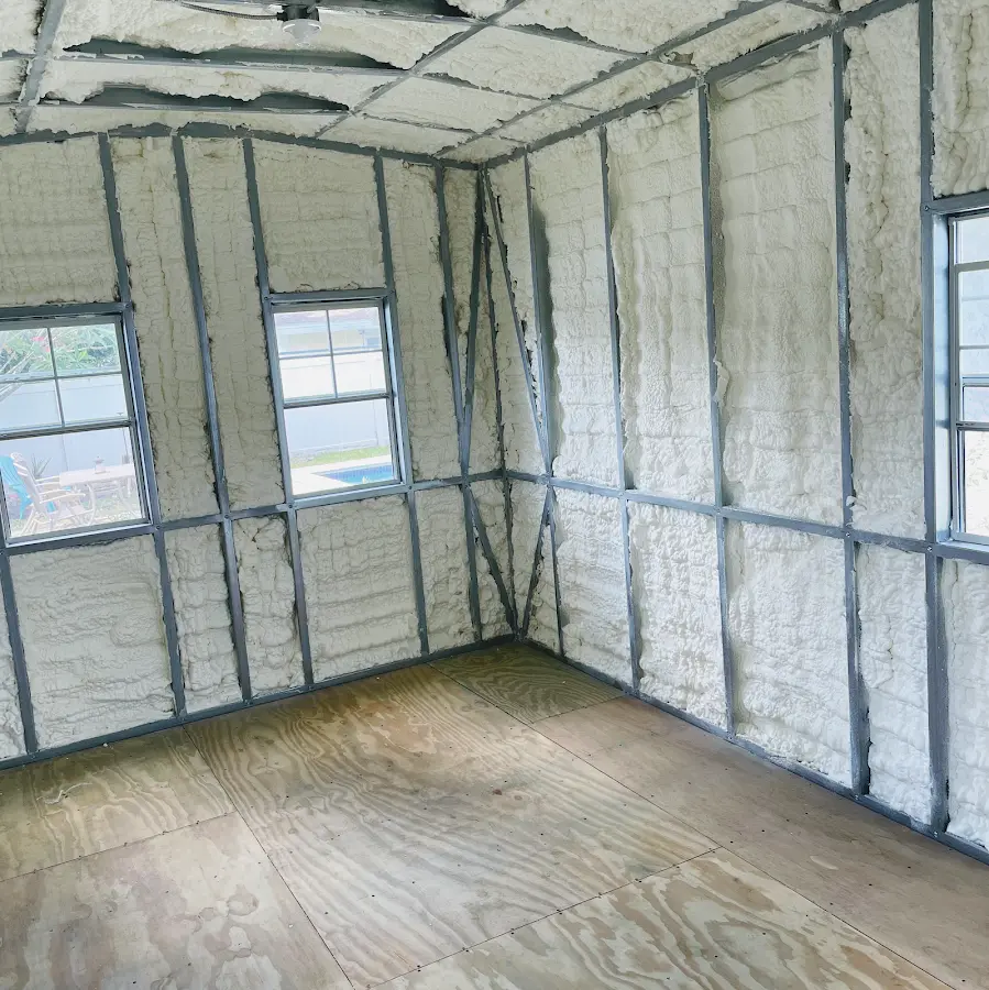 Closed-cell spray foam insulation applied to wall cavities in a residential project in Kenai